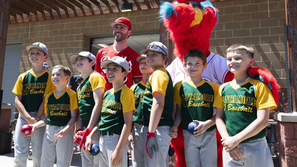 Tyler Naquin gives batting gloves to young ballplayers