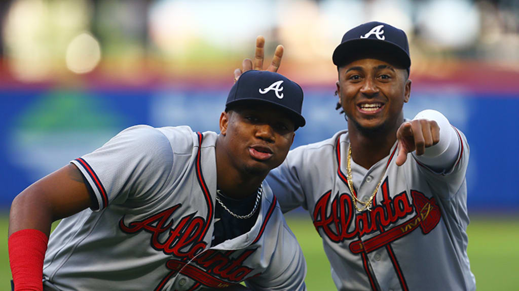 Ozzie Albies messes with Ronald Acuña Jr.