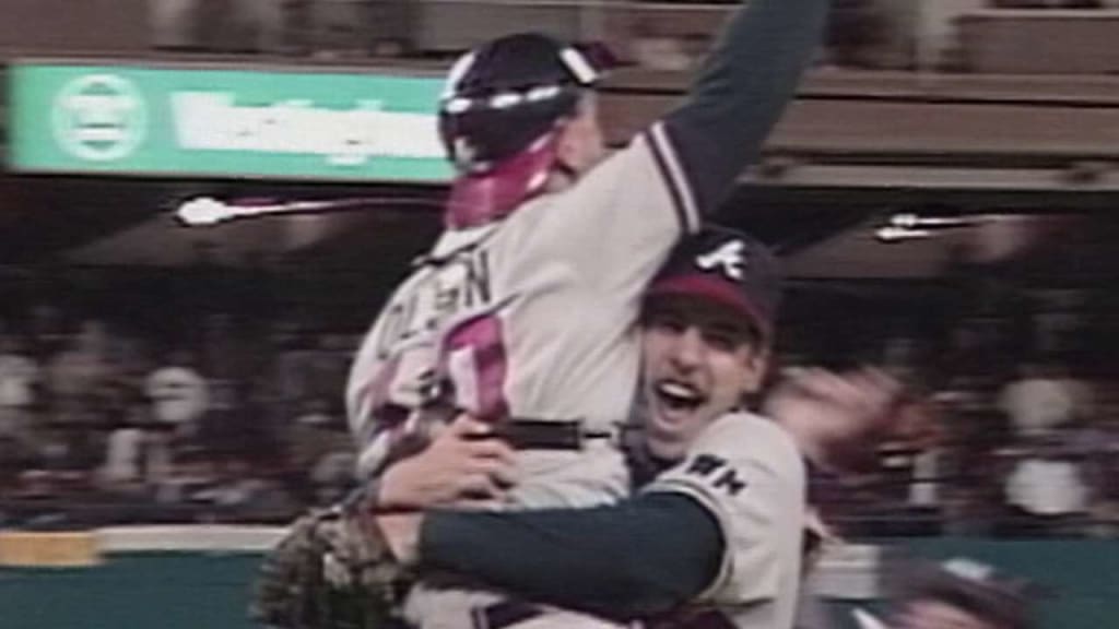 Atlanta Braves pitcher John Smoltz points towards catcher Greg Olson after  the Braves defeated the Pittsburgh Pirates, 4-0, to win Game 7 of the  National League playoffs at Three Rivers Stadium in