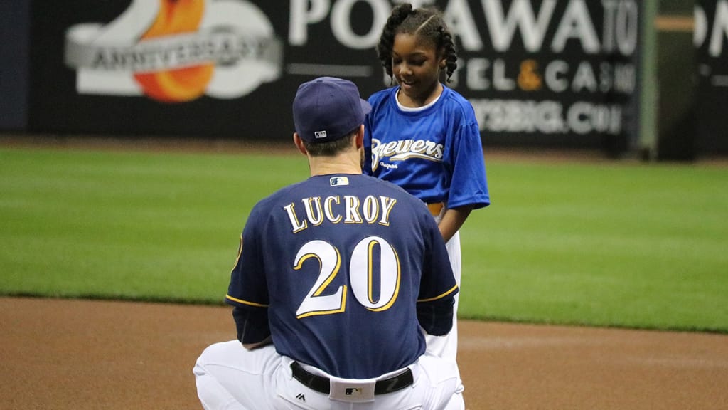 Jonathan Lucroy of the Brewers talks to a student from Milwaukee Public Schools, who took part in the team's "Play Ball" event on Saturday at Miller Park (Caitlin Moyer/Brewers).