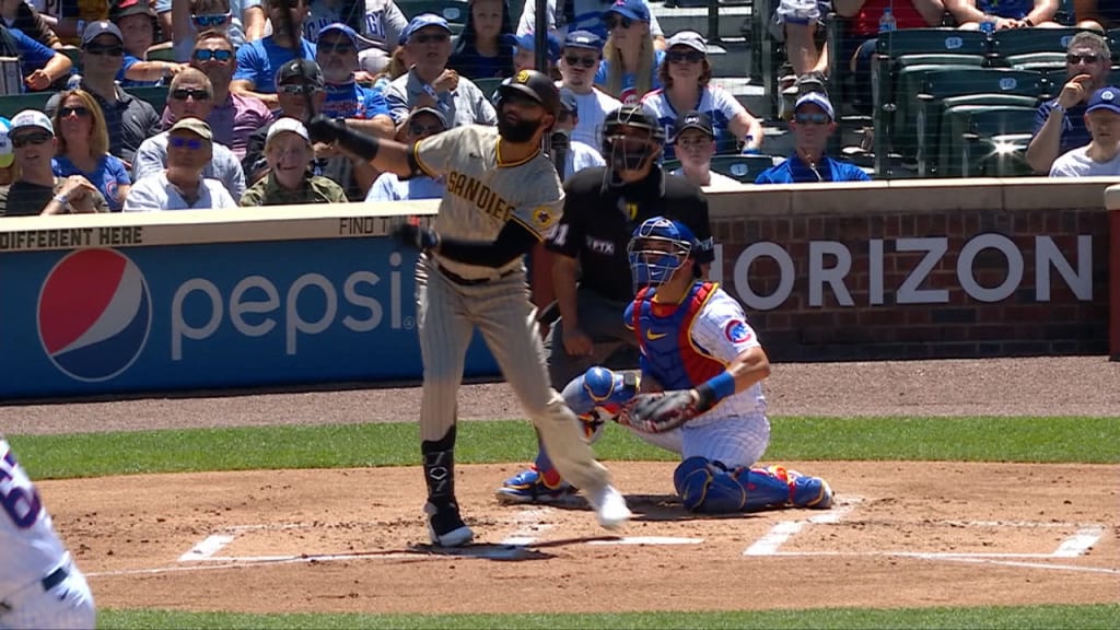 Luke Voit of the San Diego Padres rips open his jersey as he