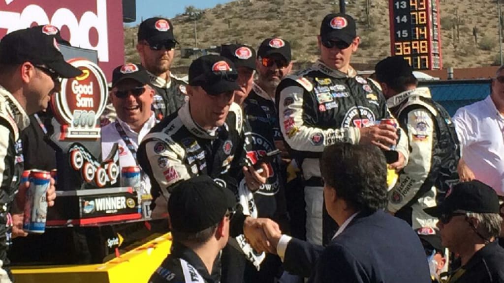 NASCAR driver Kevin Harvick celebrates his victory Sunday at the Good Sam 500 in Phoenix.