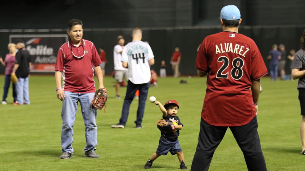 Play catch on the field before Diamondbacks game on Father's Day