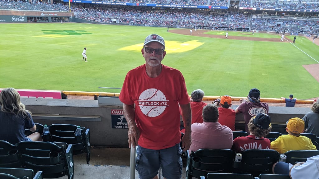 Garret Whitlock's father, Larry, watching Garrett pitch in Atlanta.
