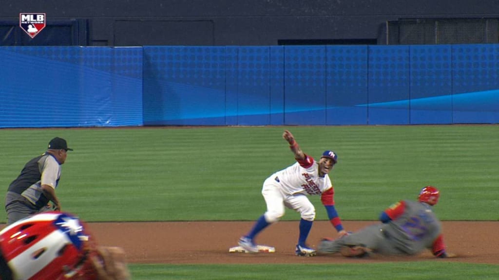 Puerto Rico's Javier Báez steals third base and magically avoids