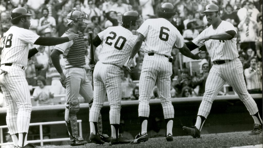 Carlos May, Bucky Dent and Roy White greet Chris Chambliss after a home run in 1977.