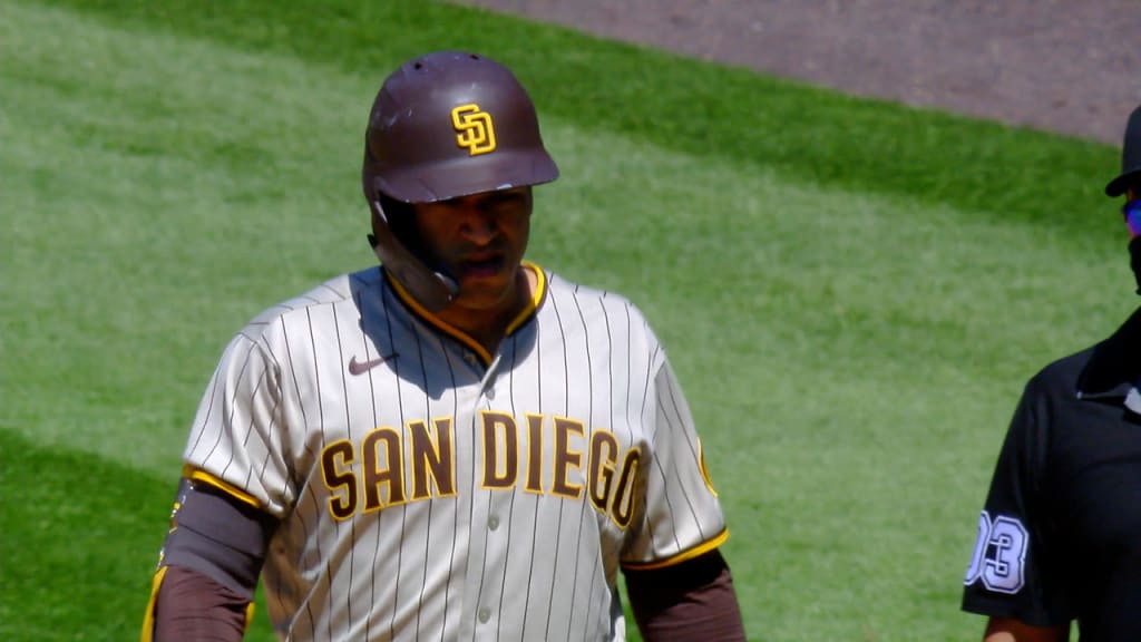 San Diego Padres' Victor Caratini heads up the first-base line after  connecting for a grand slam off Colorado Rockies relief pitcher Robert  Stephenson in the sixth inning of game one of a