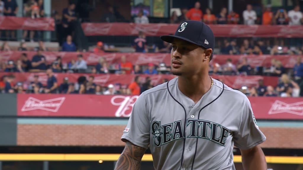 Seattle Mariners players embrace Home Run Trident