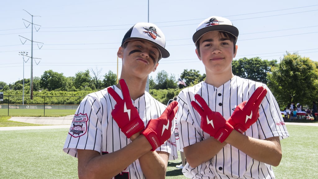 Tyler Naquin gives batting gloves to young ballplayers