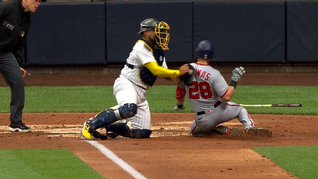 Hunter Renfroe of the Milwaukee Brewers beats a tag at second base