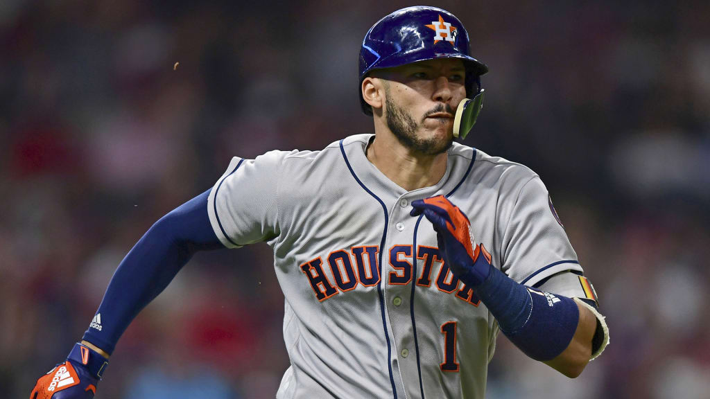 Houston Astros' Carlos Correa hits a RBI-double off Cleveland Indians relief pitcher Oliver Drake in the ninth inning of a baseball game, Friday, May 25, 2018, in Cleveland. The Astros won 11-2. (AP Photo/David Dermer)