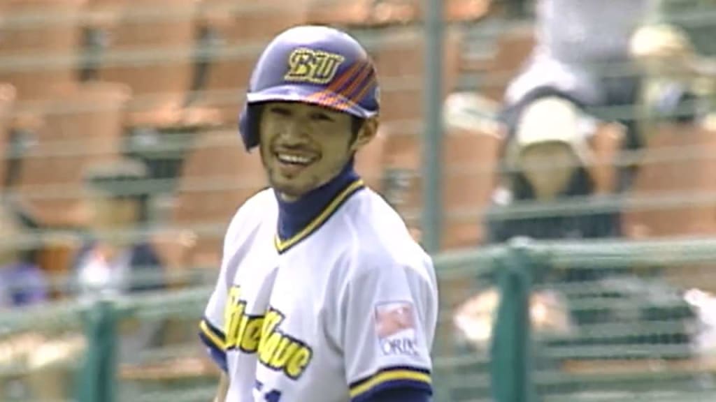 Akira Ogi, right, former manager of the Orix Blue Wave in Japan, greets his  former player Seattle Mariners' Ichiro Suzuki after throwing out the first  pitch of the game against the New