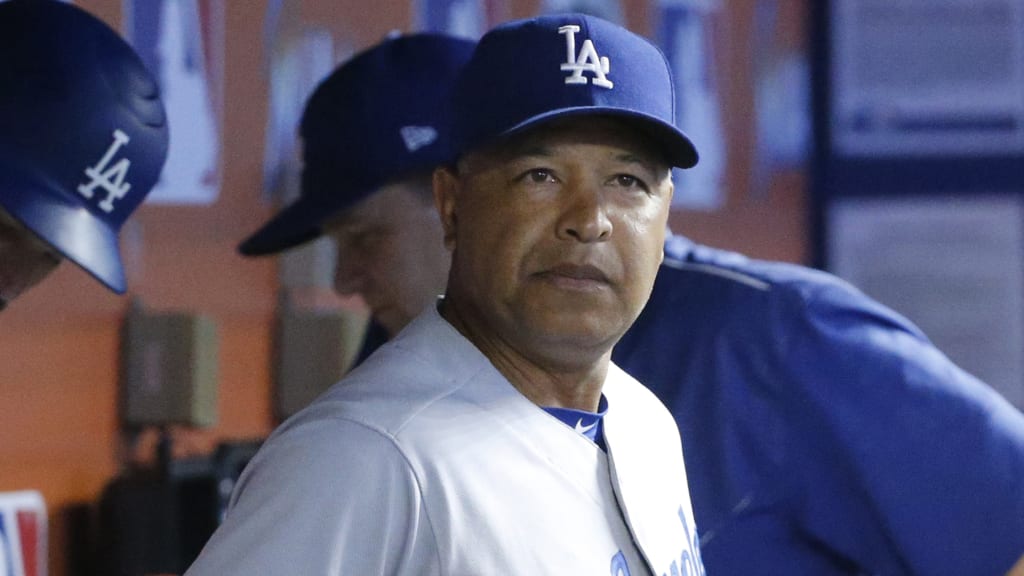 Dodgers manager Dave Roberts likes the composition of his current roster, and isn't certain the team will add players. (AP)