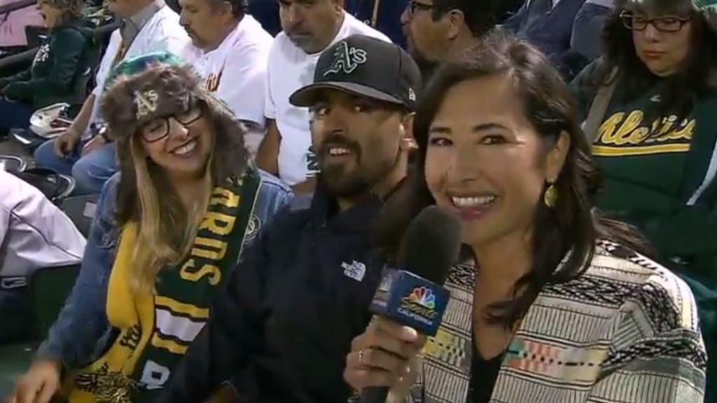 Four A's fan couples with wedding plans sat next to each other at the  Oakland Coliseum