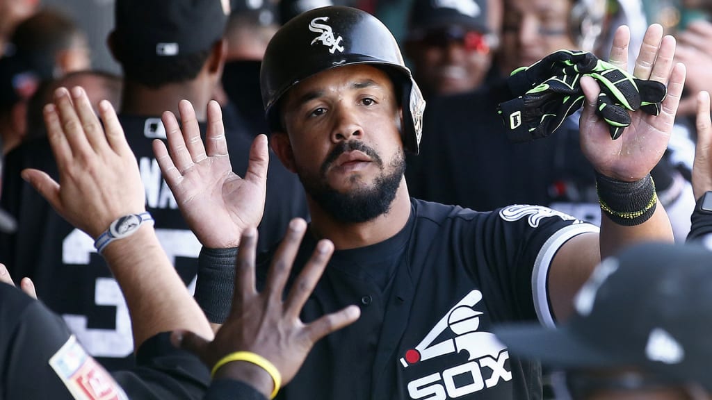 Chicago White Sox's Jose Abreu gets high-fives after scoring a run against the Milwaukee Brewers during the fourth inning of a spring training baseball game Tuesday, March 6, 2018, in Glendale, Ariz. (AP Photo/Ross D. Franklin)