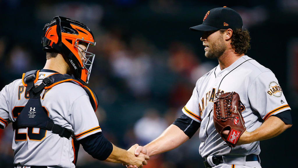 Hunter Strickland celebrates with Buster Posey after the final out of Tuesday's 9-4 win over Arizona. (AP)