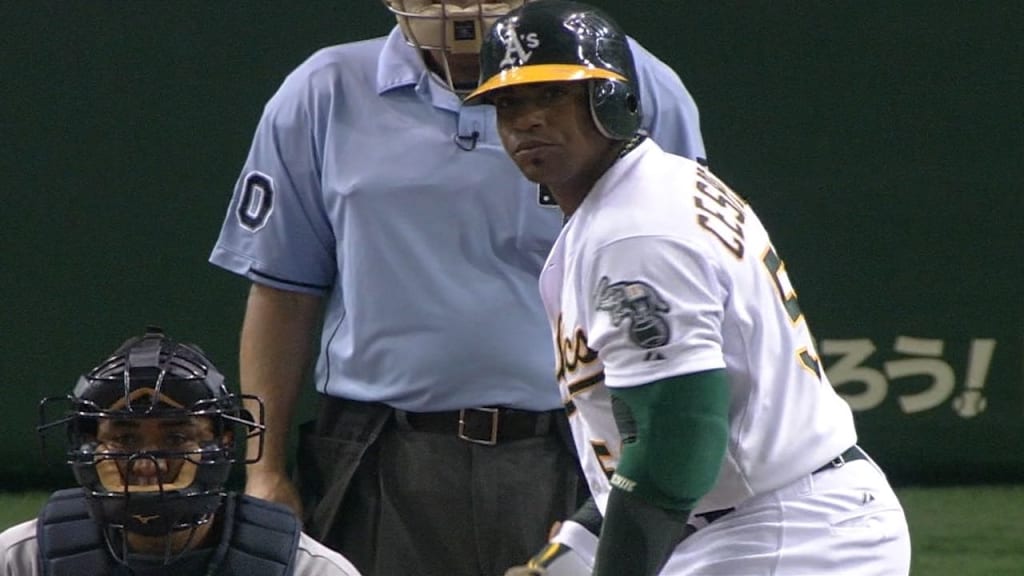 Oakland Athletics' Yoenis Cespedes high-fives Oakland Athletics