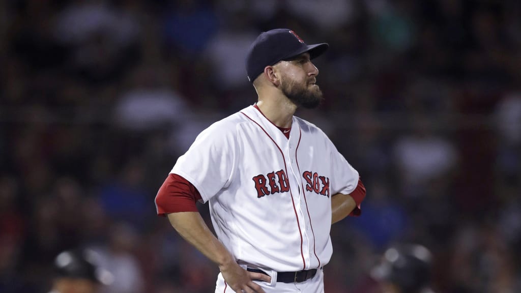 Boston Red Sox relief pitcher Matt Barnes stands on the mound after giving up a home run to Miami Marlins' Starlin Castro, which tied the game at 4-4, during the eighth inning of a baseball game at Fenway Park in Boston, Tuesday, Aug. 28, 2018. (AP Photo/Charles Krupa)