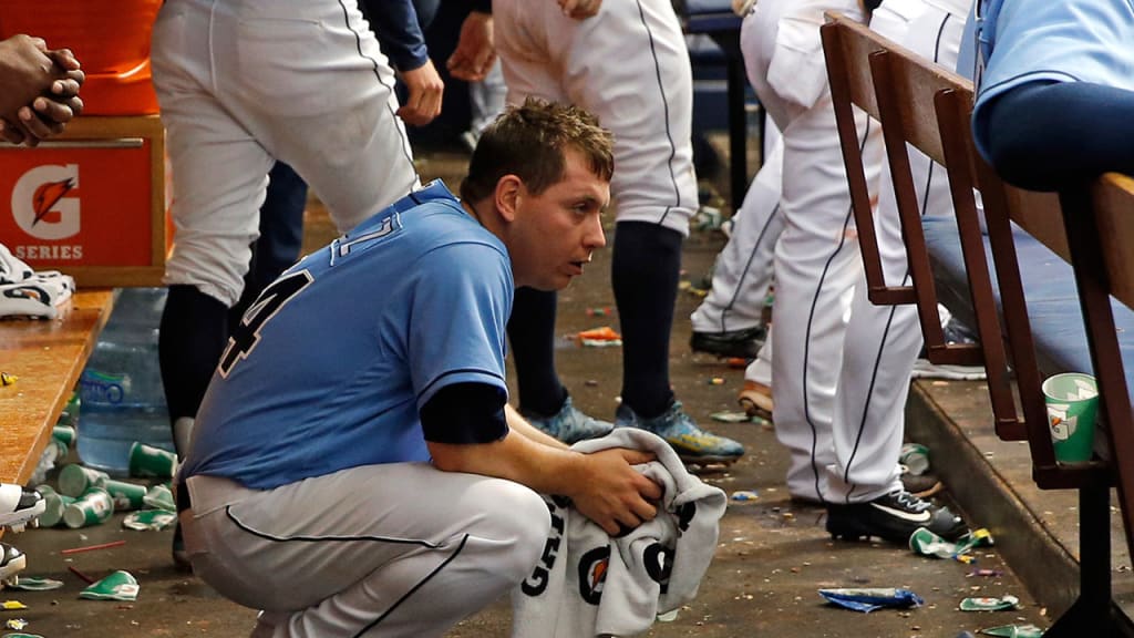 Steve Geltz in the Rays' dugout after allowing a go-ahead homer to the A's Danny Valencia on Sunday. (AP)