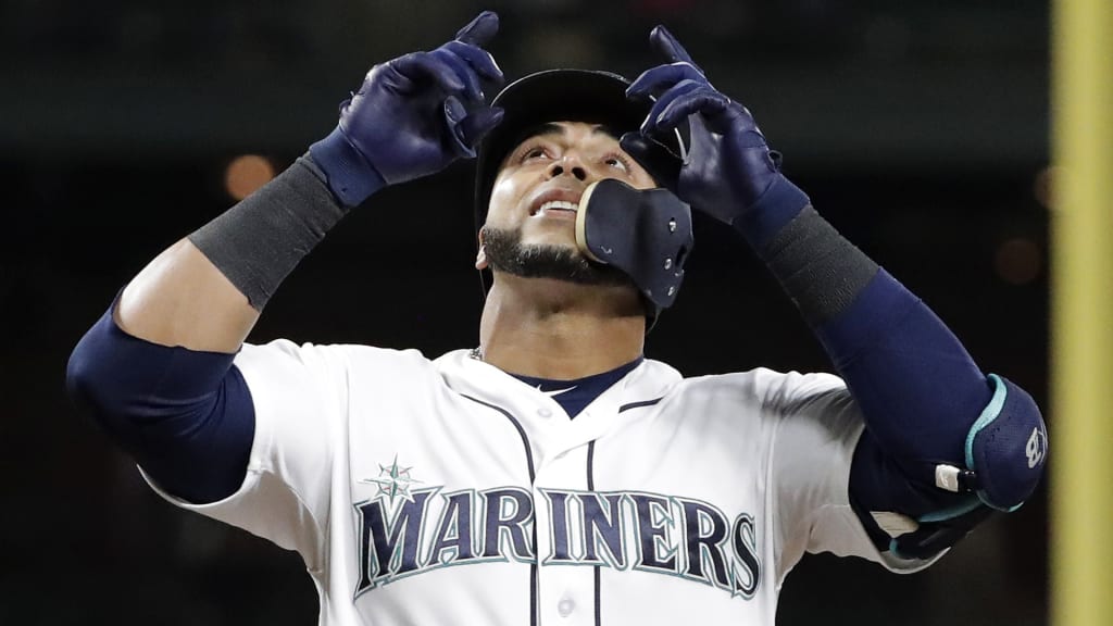 Seattle Mariners' Nelson Cruz looks up as he crosses the plate after he hit a solo home run against the Houston Astros during the fourth inning of a baseball game, Monday, April 16, 2018, in Seattle. (AP Photo/Ted S. Warren)