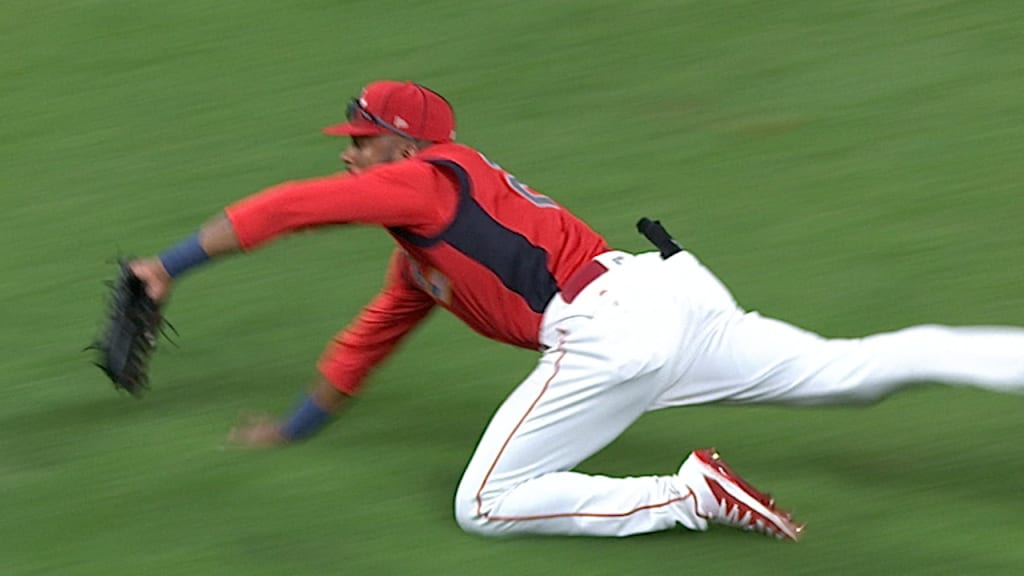 Jorge Mateo, of the Oakland Athletics, tags out Cristian Pache, of the  Atlanta Braves, during the seventh inning of the MLB All-Star Futures  baseball game, Sunday, July 7, 2019, in Cleveland. The