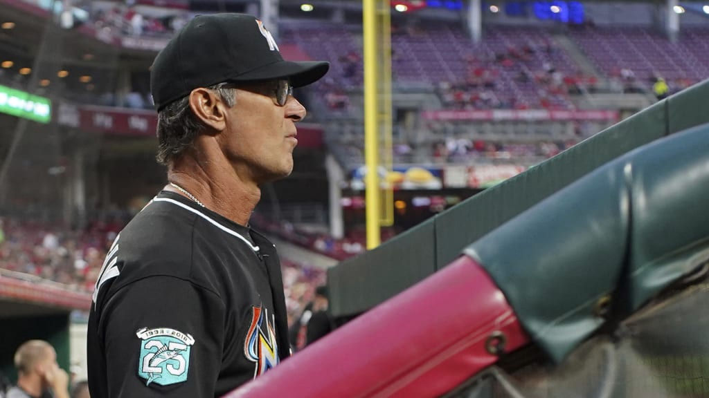 Miami Marlins' manager Don Mattingly stands in the dugout in the fourth inning of a baseball game against the the Cincinnati Reds, Friday, May 4, 2018, in Cincinnati. (AP Photo/Aaron Doster)
