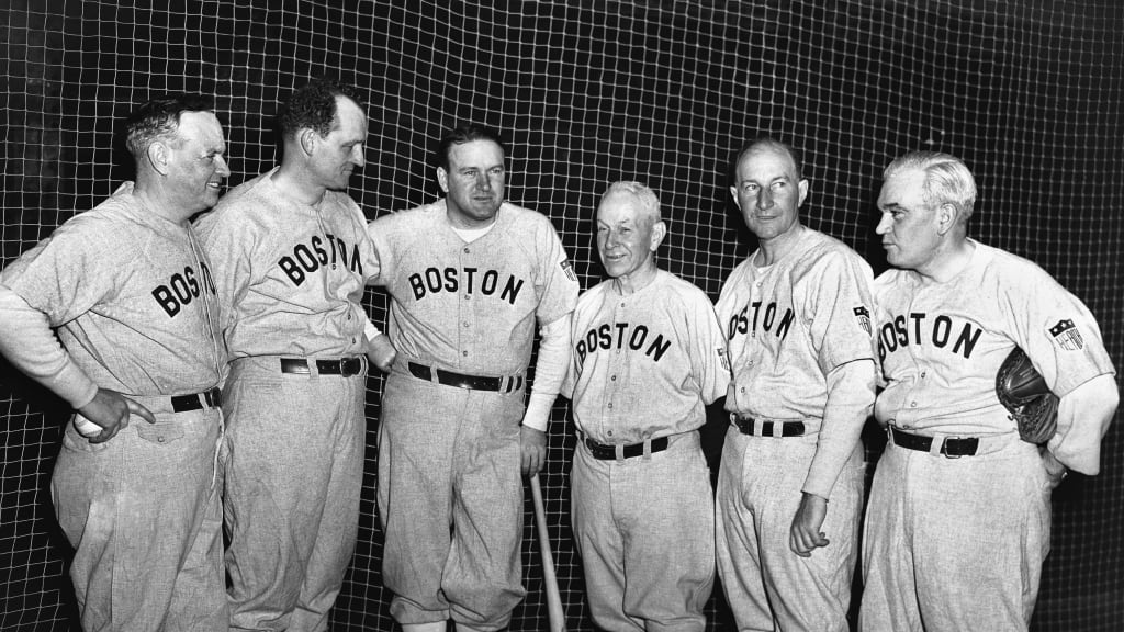 The 1944 Red Sox brain trust at Tufts College for Spring Training in 1944. Due to players serving in WWII, they outnumbered the players six to four at the first workout.