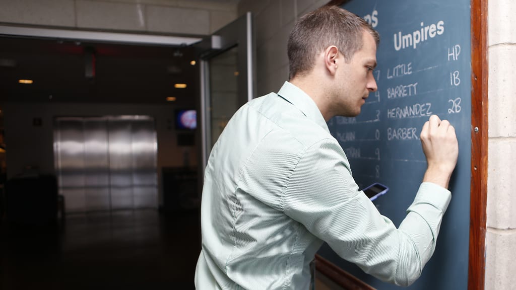 Hours before the game, the night's lineup and umpires are listed in the press box. (New York Yankees)