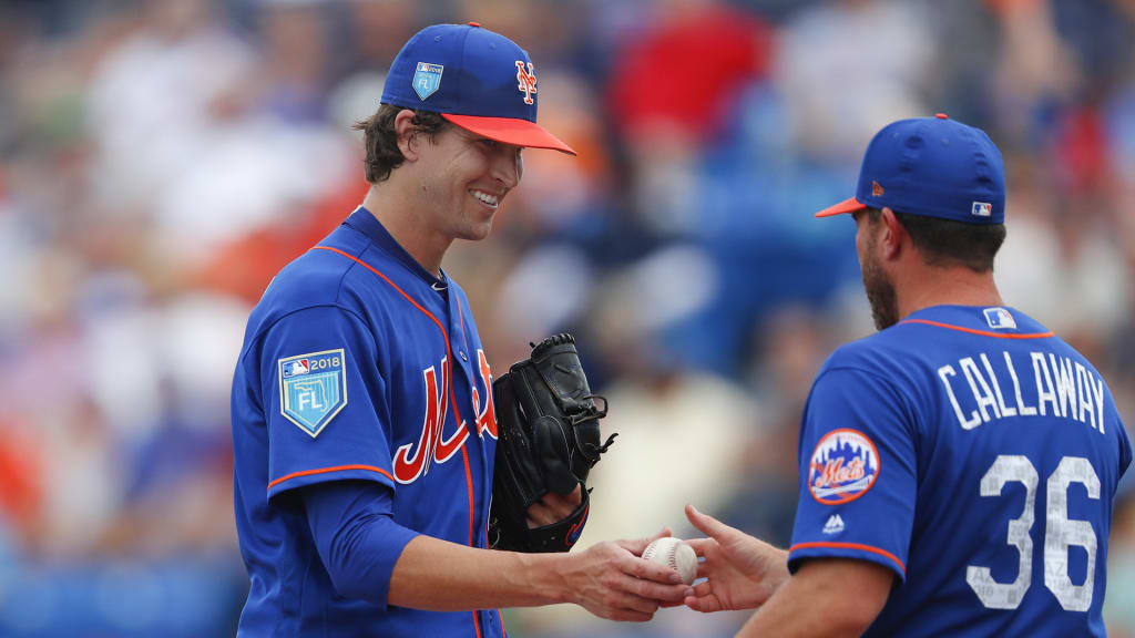 New York Mets starting pitcher Jacob deGrom (48) hands the ball to manager Mickey Callaway (36) as he is relived in the third inning of a spring training baseball game against the Houston Astros, Sunday, March 11, 2018, in Port St. Lucie, Fla. (AP Photo/John Bazemore)