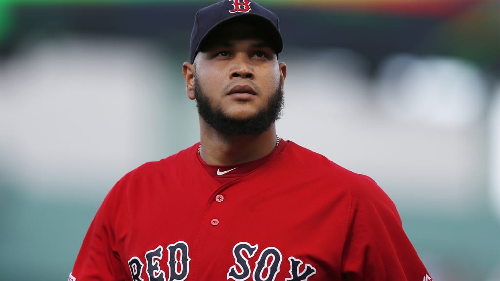 Red Sox pitcher Eduardo Rodriguez wants a ride in the laundry cart