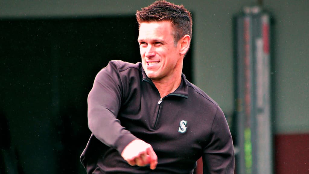 General manager Jerry Dipoto threw for 10-15 minutes on Sunday, following the Mariners' first full-squad workout. (MLB.com)