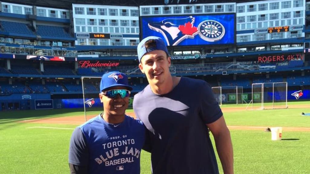 Members of the Blue Jays put their hats back on after the national