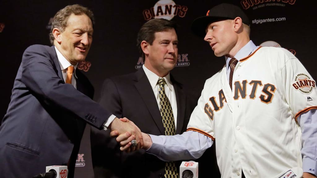 Giants president and CEO Larry Baer welcomed closer Mark Melancon to the club in December. (AP)