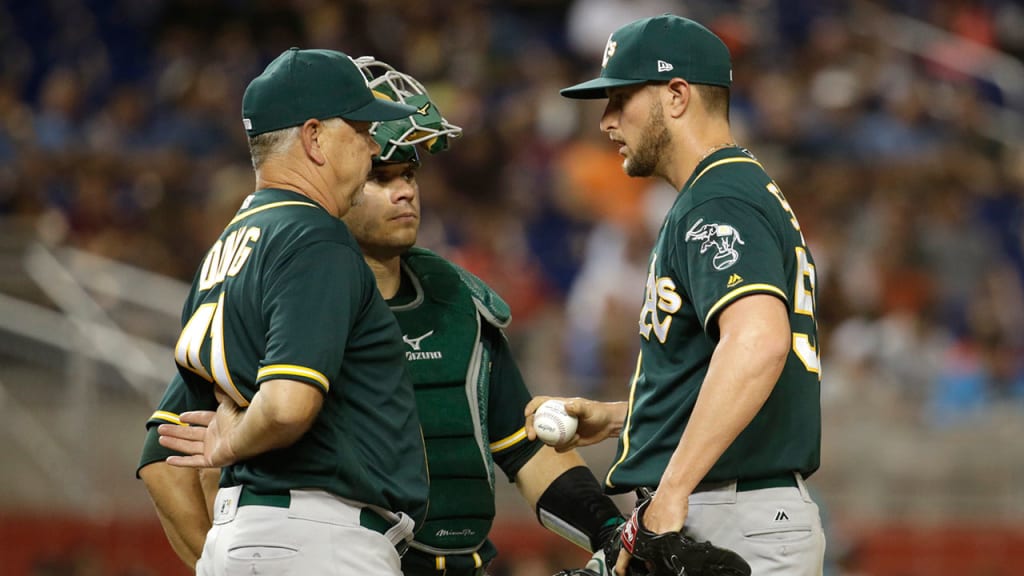 Curt Young (left) spent 23 years in an Oakland uniform as a player and coach. (AP)