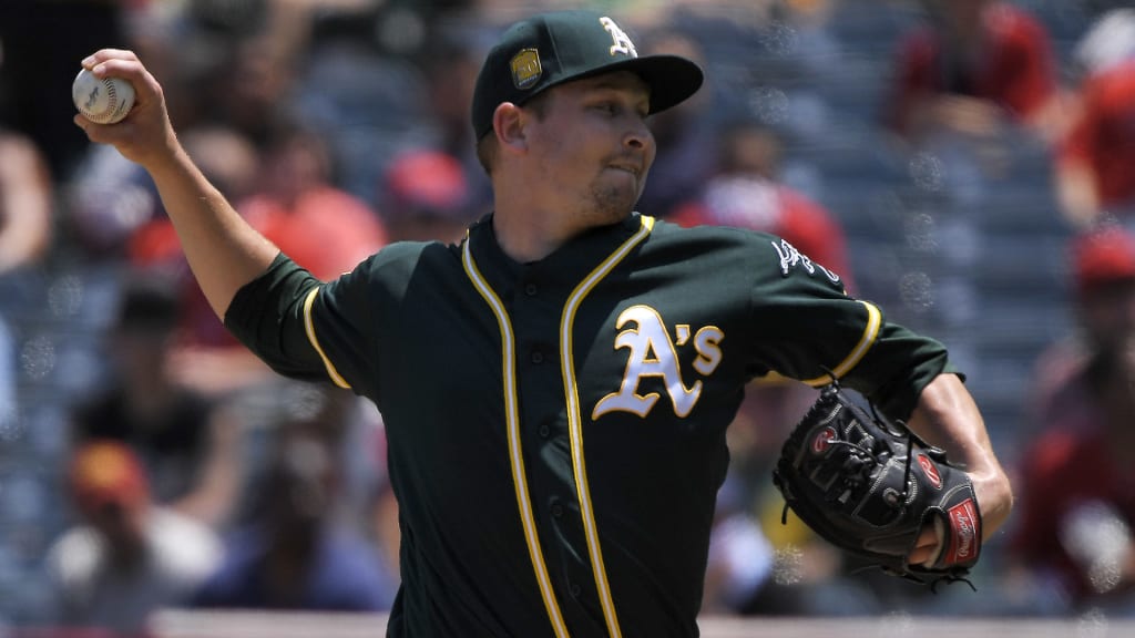 Oakland Athletics starting pitcher Trevor Cahill throws to the plate during the first inning of a baseball game against the Los Angeles Angels, Sunday, Aug. 12, 2018, in Anaheim, Calif. (AP Photo/Mark J. Terrill)
