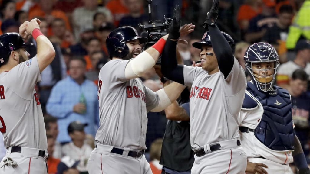 Boston Red Sox's Mookie Betts laughs after being doused with