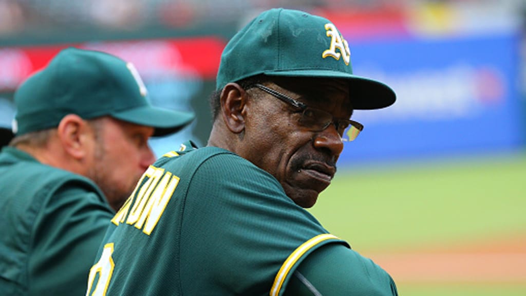 A's third base coach Ron Washington, looking on from the dugout during a game with Texas this season, has left Oakland to join the Braves' coaching staff. The move enables Washington to be closer to his home in Louisiana. (Rick Yeatts/Getty)