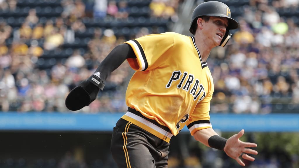Pittsburgh Pirates pinch runner Kevin Newman, right, heads for home plate as he tries to score in the seventh inning of a baseball game, Sunday, Aug. 19, 2018, in Pittsburgh. (AP Photo/Keith Srakocic)