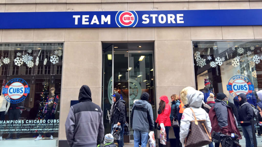 Fans visit the Commissioner's Trophy at the new team store along the Magnificent Mile. (Cubs)