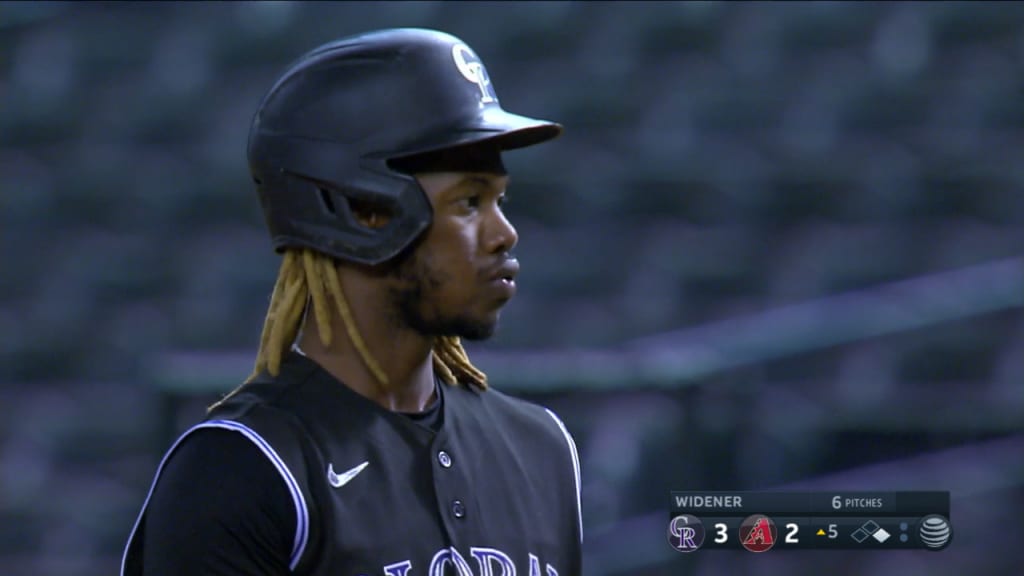 Raimel Tapia of the Colorado Rockies loses his helmet while