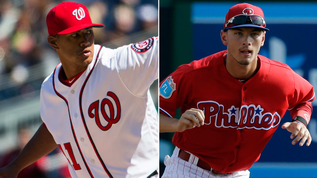 The Nationals' Joe Ross and the Phillies' Tyler Goeddel remain close even as they play for different teams. (AP)