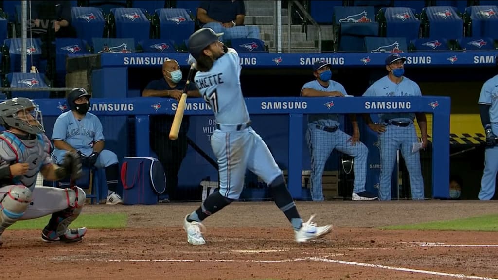 Jordan Romano of the Toronto Blue Jays walks back to the dugout