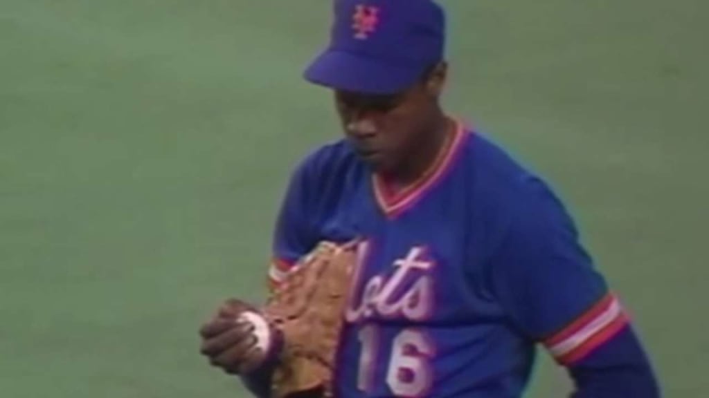 New York Mets' Julio Franco tosses the ball back to home plate as