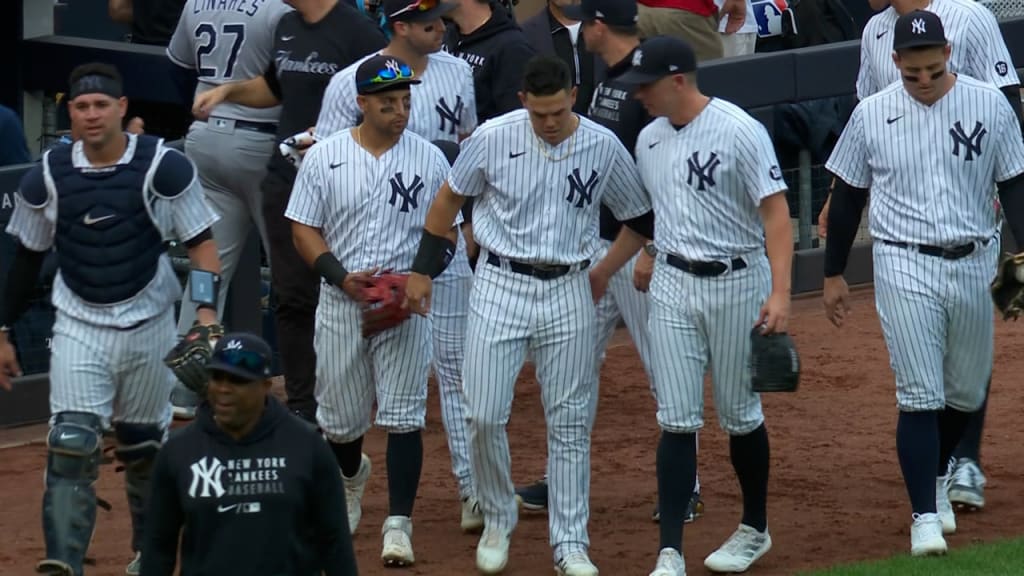 New York Yankees Gio Urshela smiles in the dugout before a