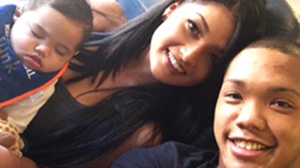 Addison Russell (right) relaxes with his baby son, Aiden, and his wife, Melisa. (Courtesy of Addison Russell)