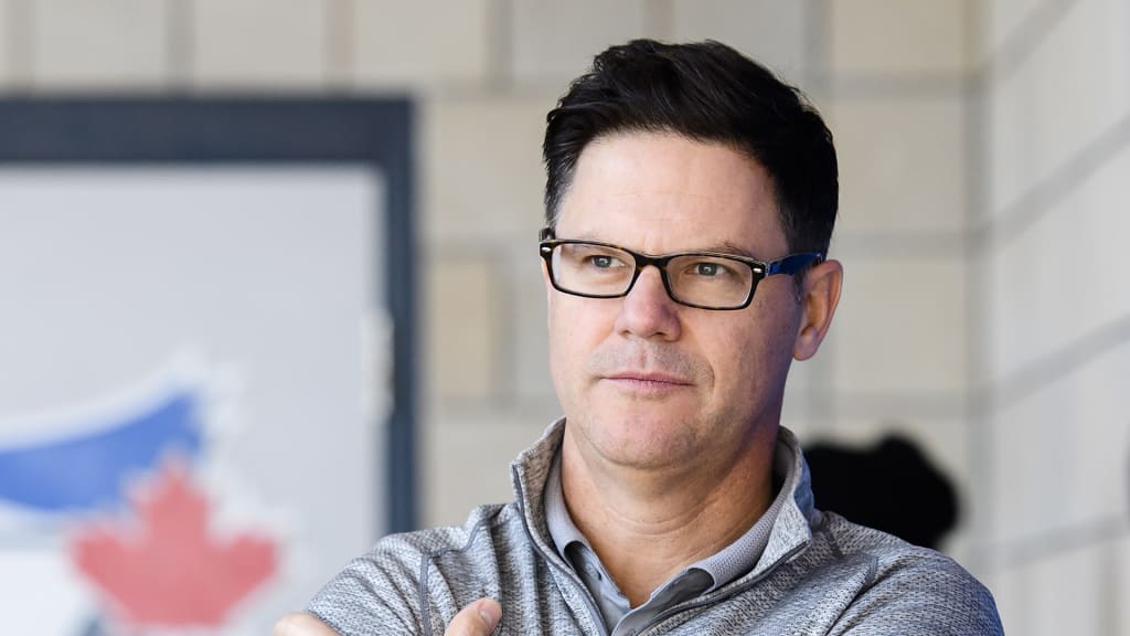 Toronto Blue Jays general manager Ross Atkins looks on during spring training baseball practice in Dunedin, Fla., on Thursday, Feb. 14, 2019. (Nathan Denette/The Canadian Press via AP)
