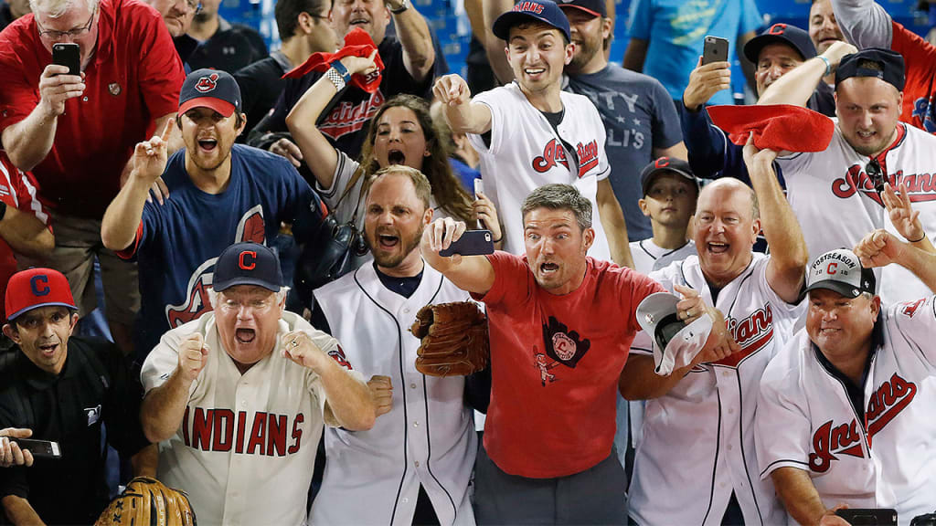 Cleveland fans at Rogers Centre cheer after the Indians defeated the Toronto Blue Jays on Wednesday to clinch a return to the World Series. (AP)