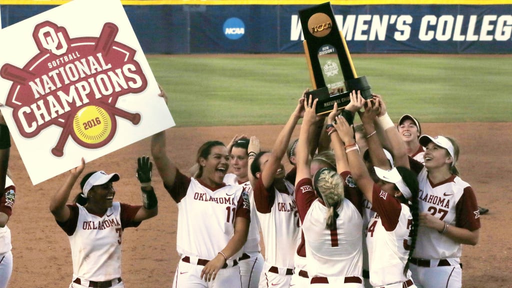 Oklahoma players celebrate with the trophy after defeating Auburn, 2-1, in the NCAA Women's College World Series. (AP Photo)