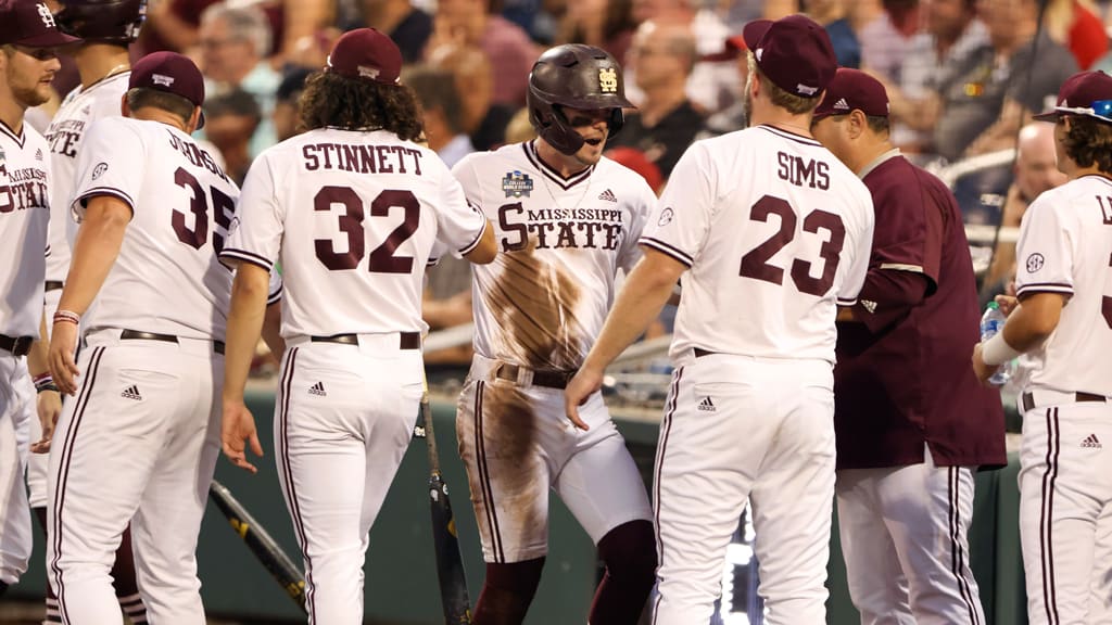 Mississippi State's Tanner Allen (center) celebrates with teammates during Game 2 of the CWS.