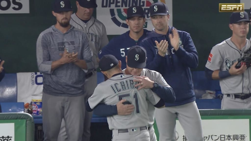 Ichiro Suzuki of the Seattle Mariners embraces manager Scott